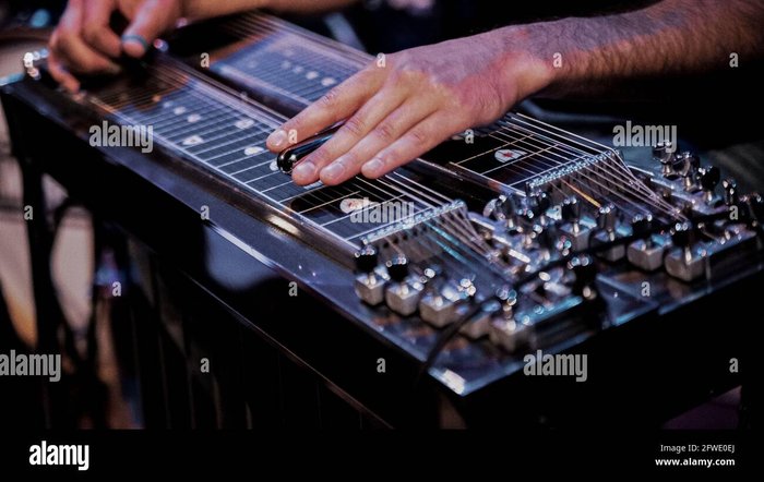 Close up of a musician playing lap steel, pedal guitar, slide ...