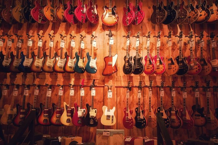 Electric Guitars on Wall · Free Stock Photo
