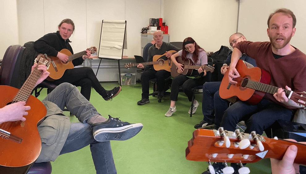 Community guitar group session at The Grassmarket Community Project